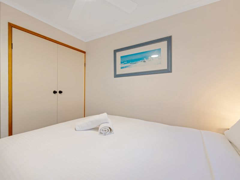 Relax in a thoughtfully prepared bedroom with towels provided for your comfort.