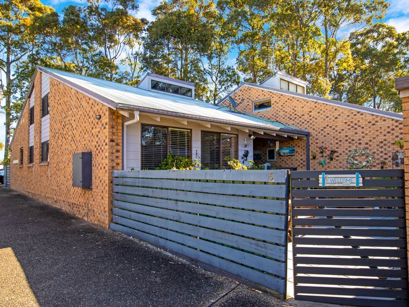 Welcoming home with a private fenced entry.