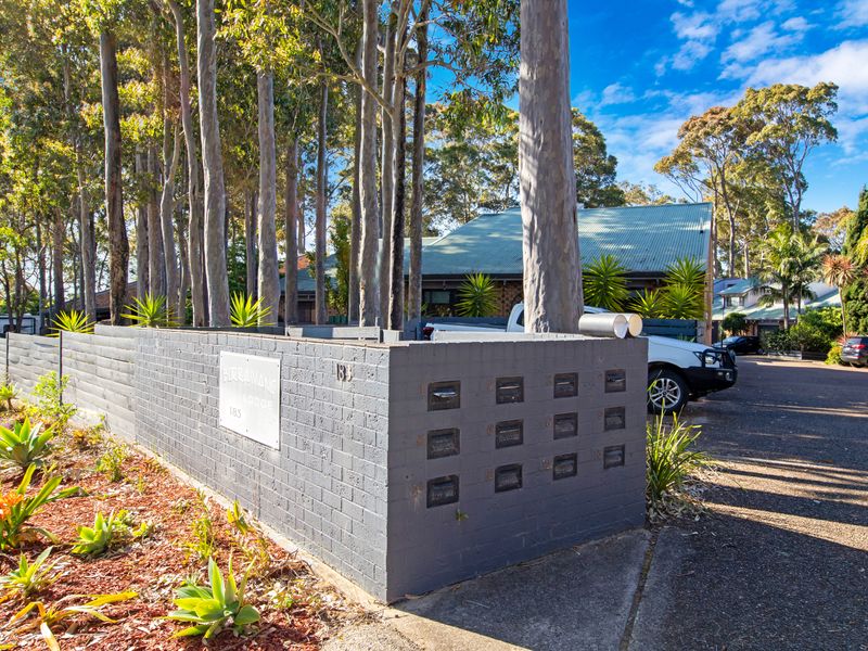 Relax in a peaceful retreat with a bright brick façade.