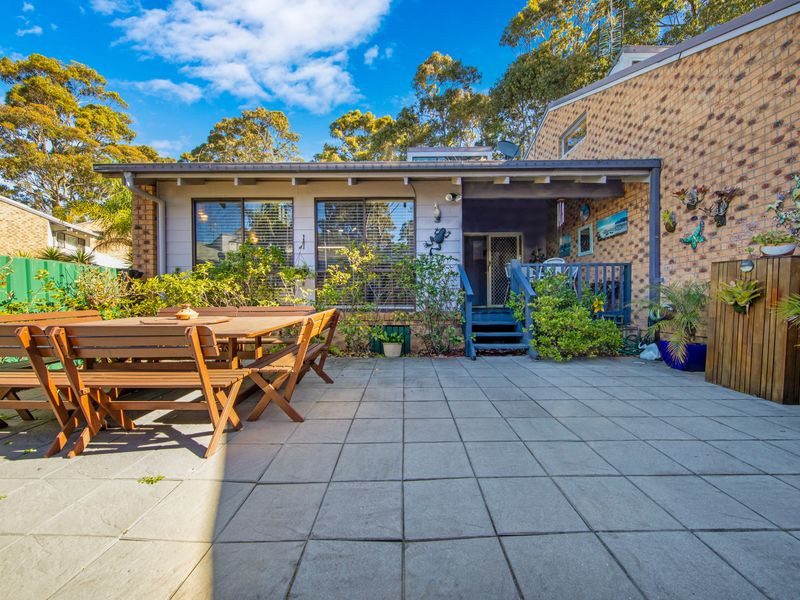Enjoy the fresh coastal air in this inviting outdoor retreat.