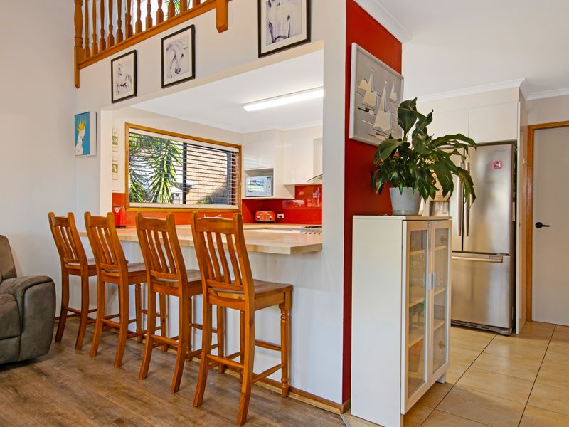 Inviting kitchen with bar stools, ideal for meals, conversations, and gatherings.