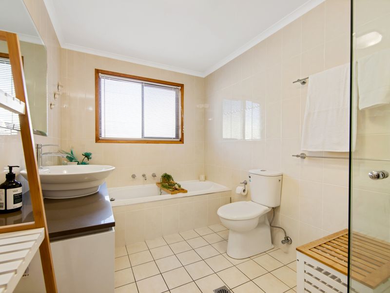 Well-appointed bathroom designed for comfort, featuring a relaxing tub.