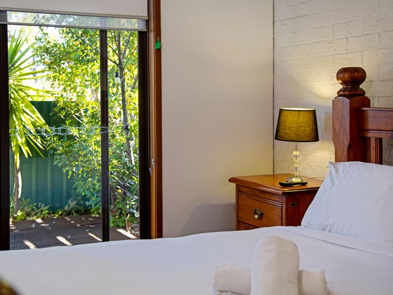Guest-ready bedroom with fresh linens and thoughtful touches.