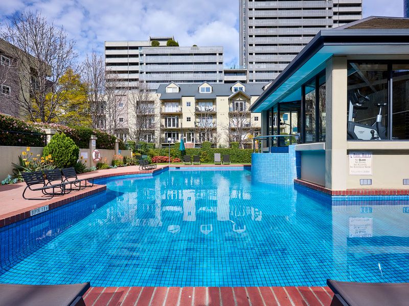 Outdoor swimming pool with sun loungers