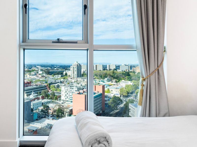 Wake up to breathtaking city views right from your window.