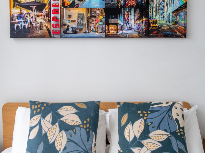 Retreat to a chic bedroom with fresh linens and vibrant décor.