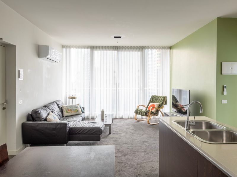 Unwind in the bright and spacious living area with plush seating.