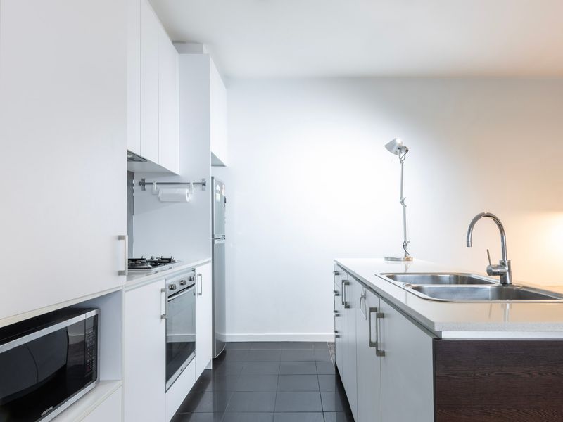 Prepare meals with ease in the sleek kitchen with gas cooktop.