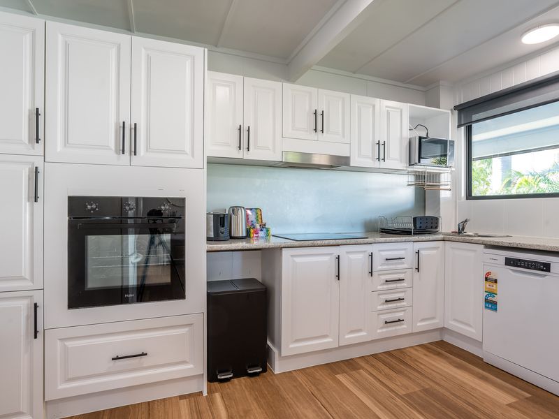 Fully equipped kitchen with modern appliances and ample storage