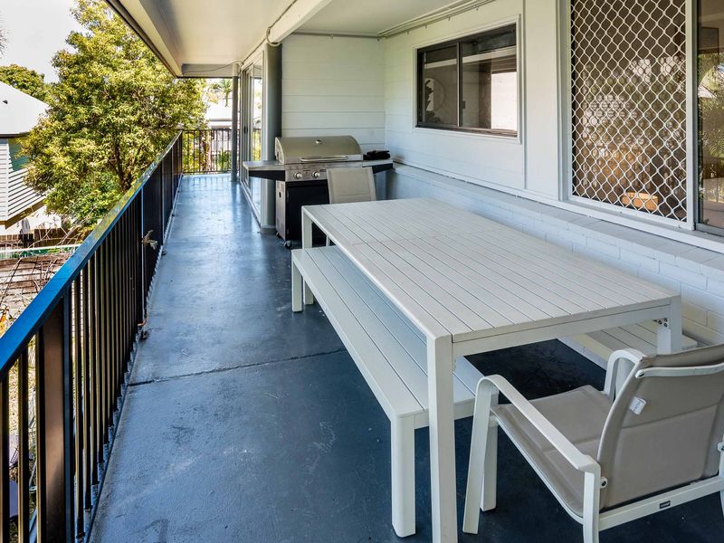 Outdoor balcony with dining table and seating for alfresco meals