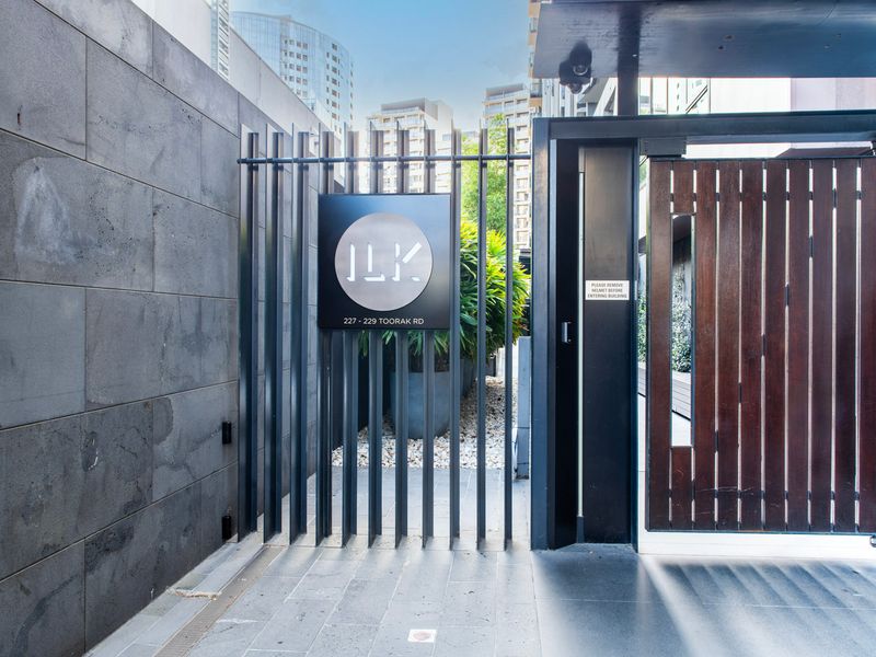 Secure gated entry with stylish design and signage
