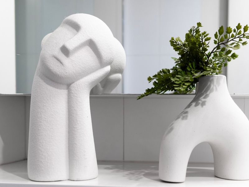 Artistic bathroom décor with modern vase display