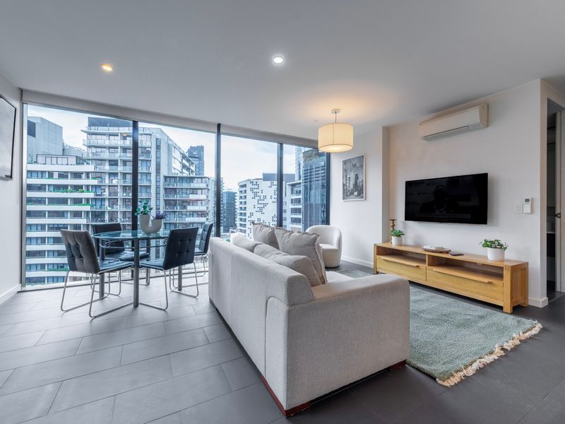 Living room with floor-to-ceiling windows and modern furniture