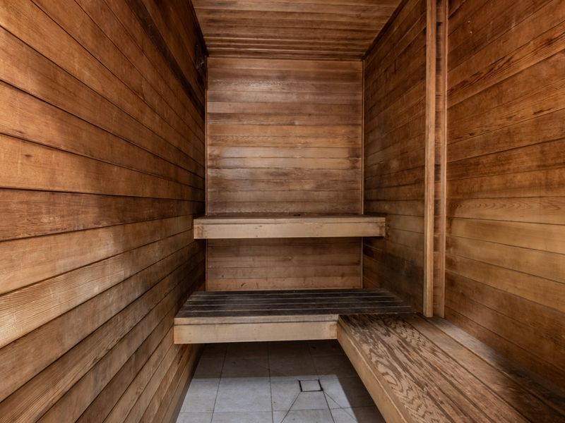 Sauna room with wooden bench seating