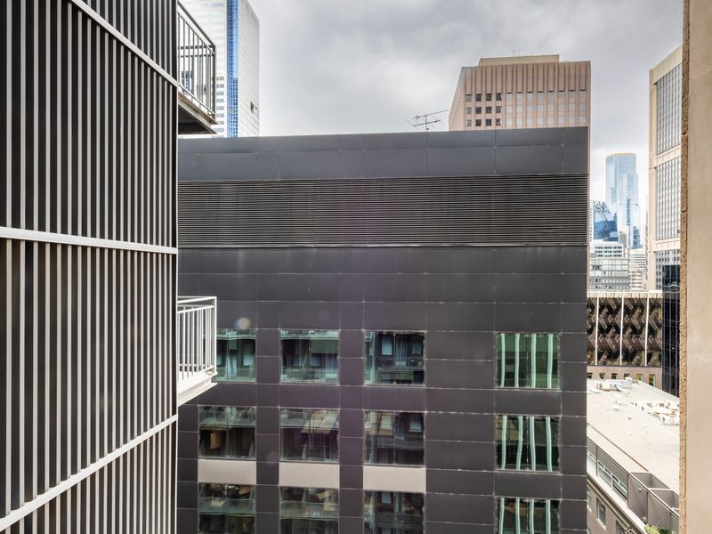 City view from the apartment balcony with nearby buildings