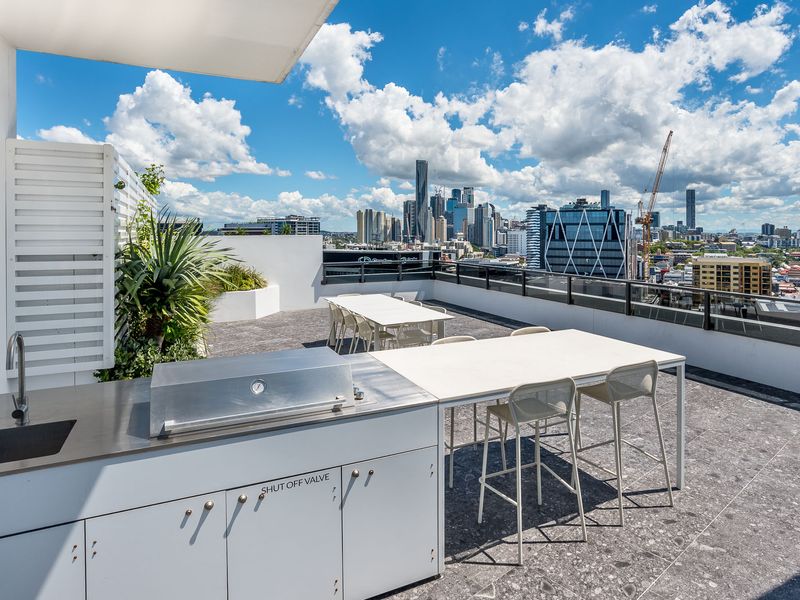 Communal BBQ area perfect for social meals with friends or family.