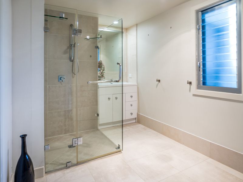 Clean bathroom with walk-in shower