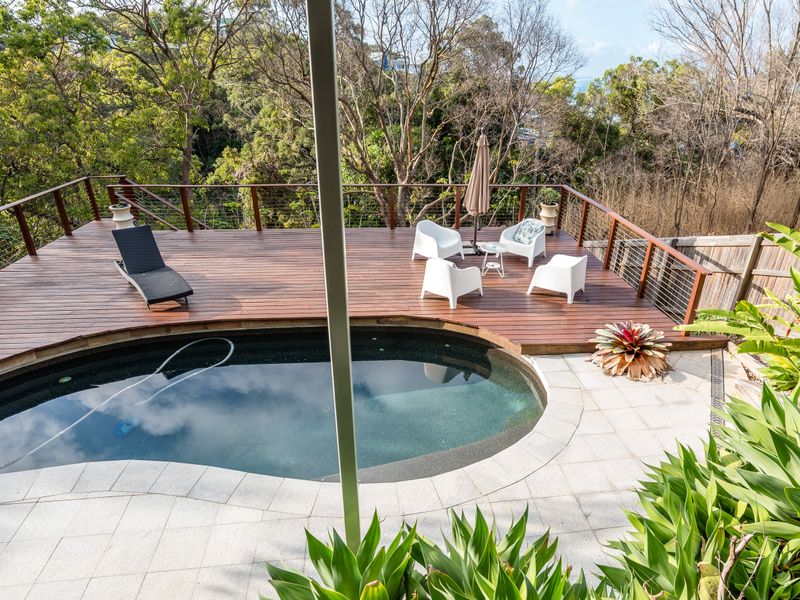 Tranquil pool surrounded by lush greenery