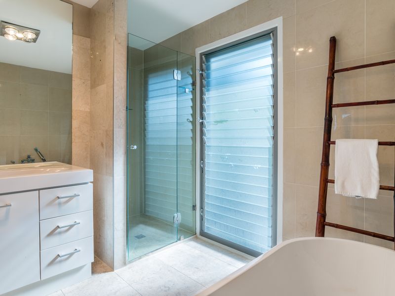 Modern ensuite with rainfall shower