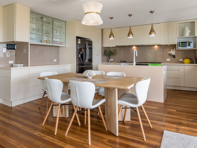 Family dining space with wooden floors