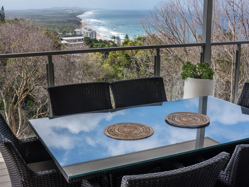 Alfresco dining with leafy backdrop