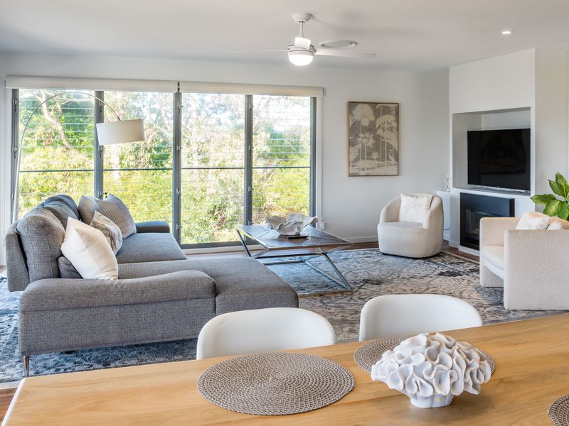 Relaxed lounge with plush seating and natural light