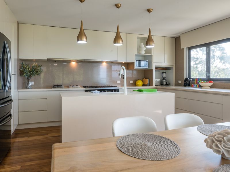 Kitchen with stainless appliances and pendant lights