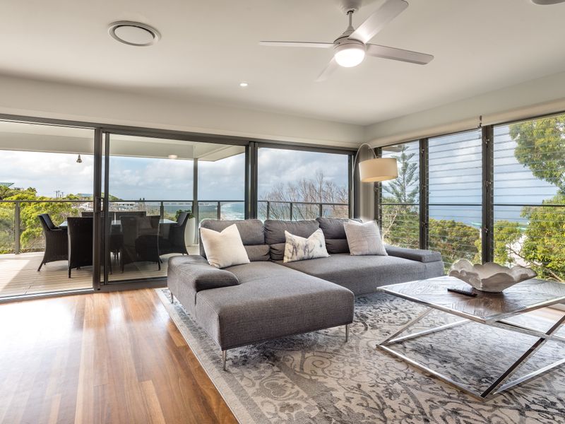 Bright living space with stunning coastal views