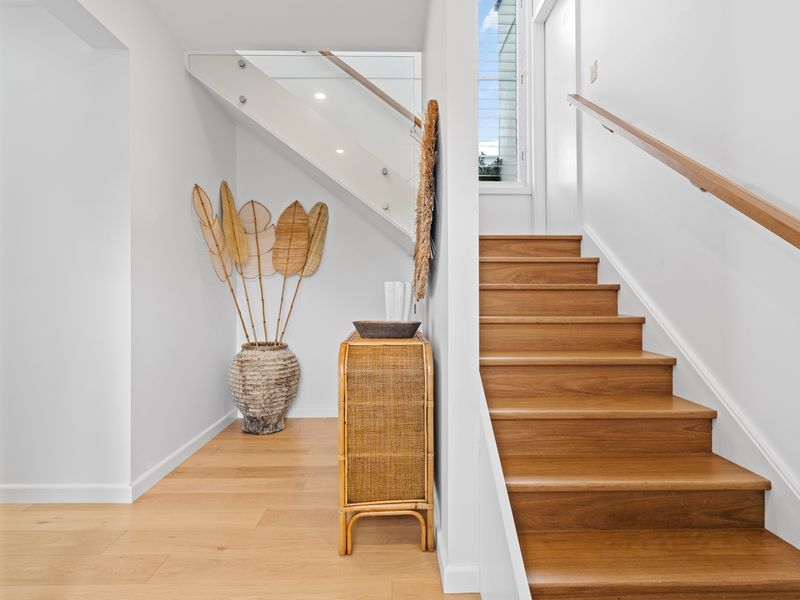 Elegant staircase with warm timber tones