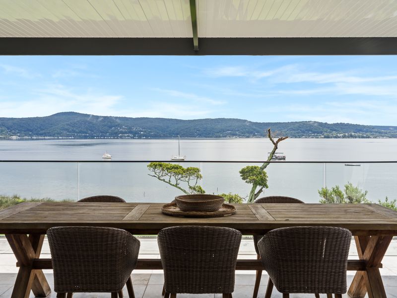 Enjoy al fresco dining with sweeping views of the tranquil waterfront.