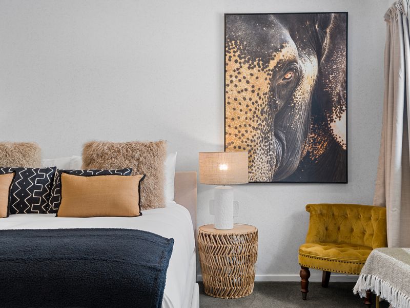 Stylish bedroom with statement artwork