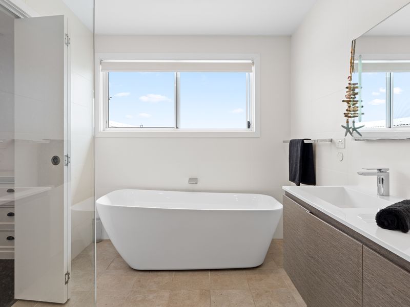 Spa-style bathroom with freestanding tub