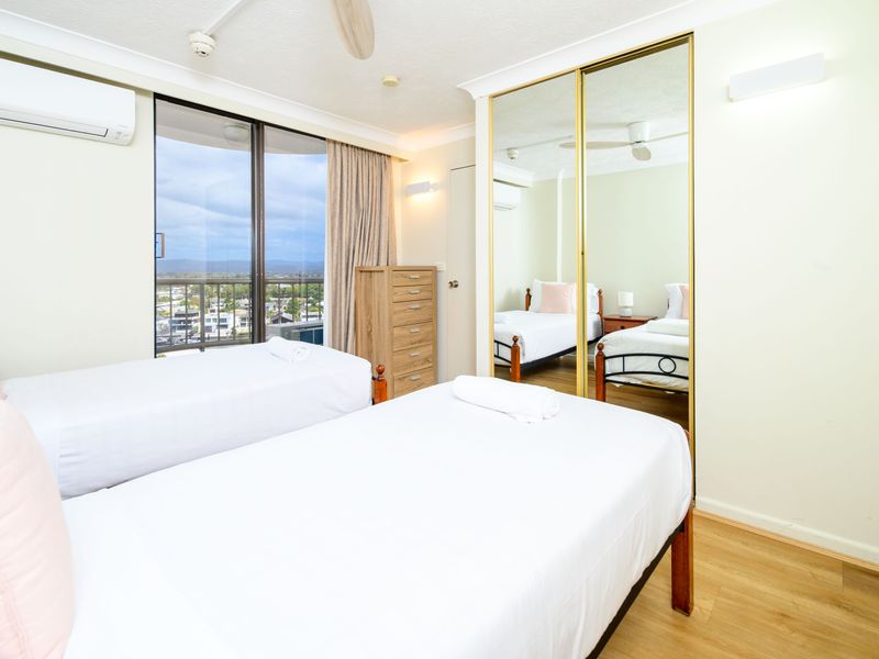 Twin bedroom with mirrored wardrobe
