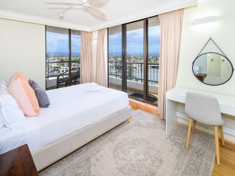 Cozy guest bedroom with large windows