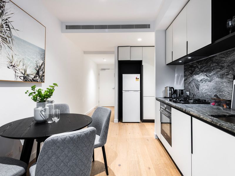 Stylish kitchen and dining space featuring quality appliances and contemporary finishes