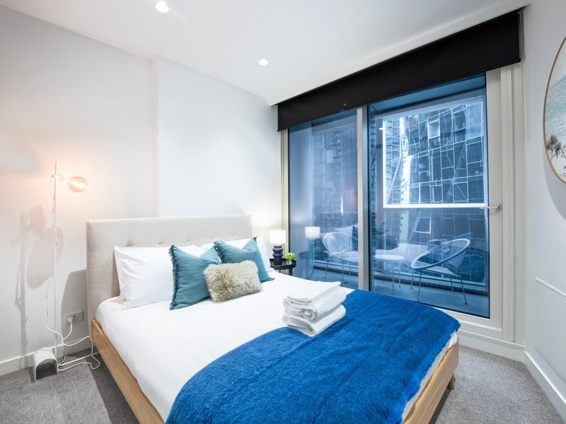 Comfortable bedroom with plush bedding