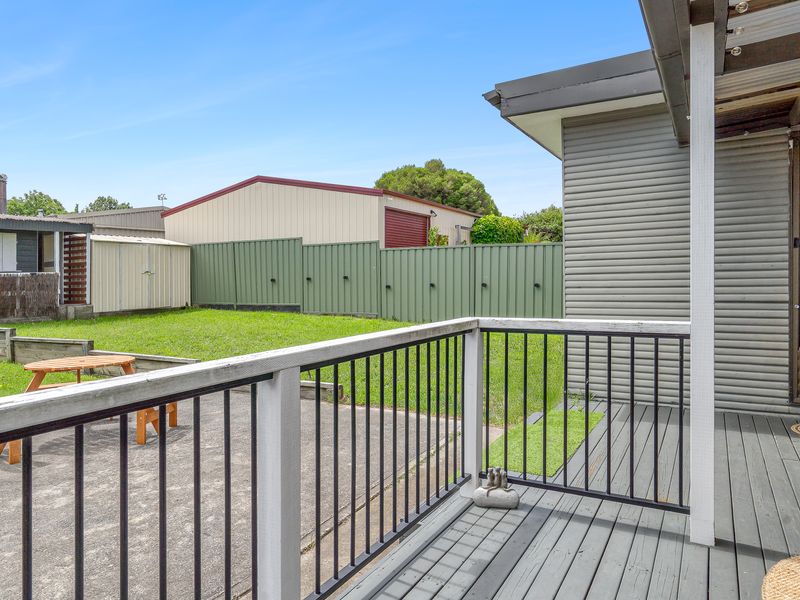 Relaxing outdoor deck overlooking the spacious backyard