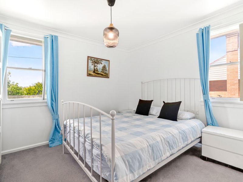 Bright and airy bedroom with soft tones and peaceful garden views