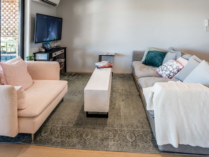 Alternate lounge angle showing generous seating and entertainment setup