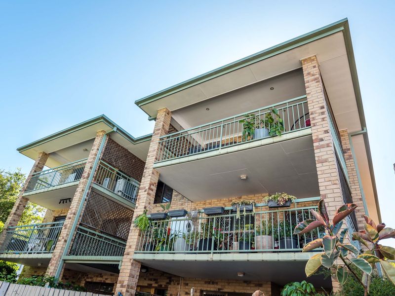 Exterior view of the building with private balconies and outdoor spaces