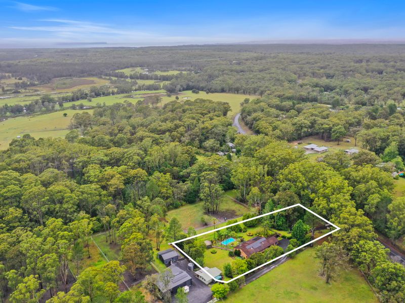 Scenic aerial outlook across rolling greenery and countryside