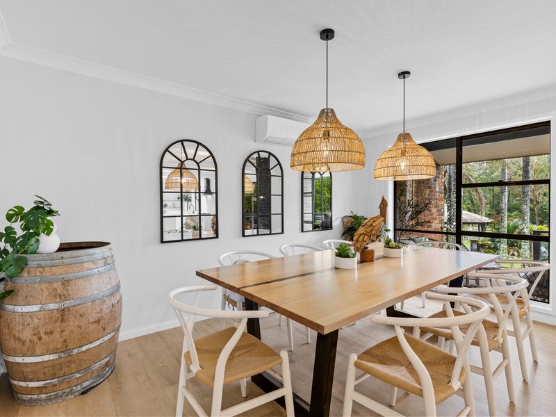 Bright dining space overlooking lush greenery