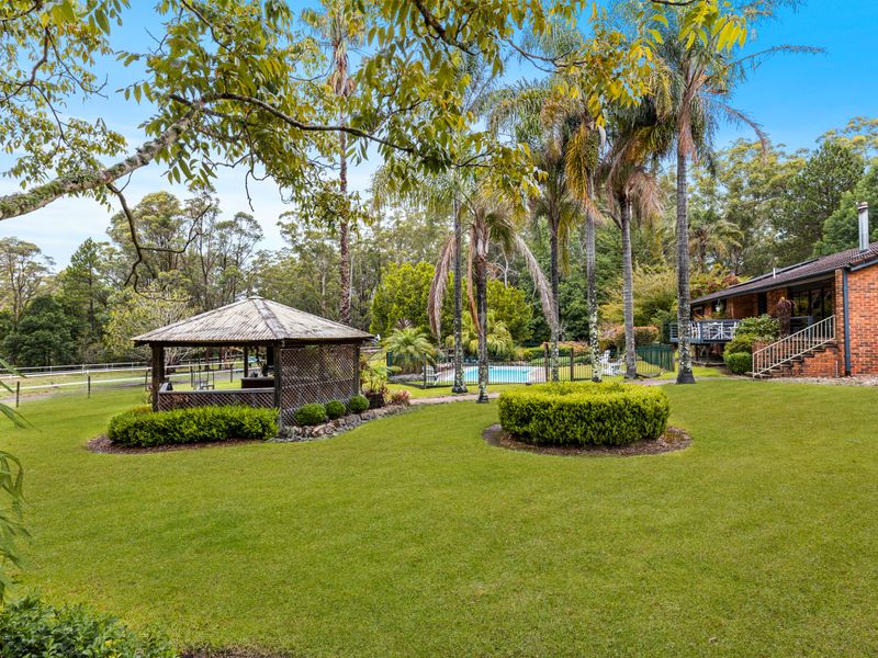 Expansive landscaped gardens with peaceful bushland surrounds