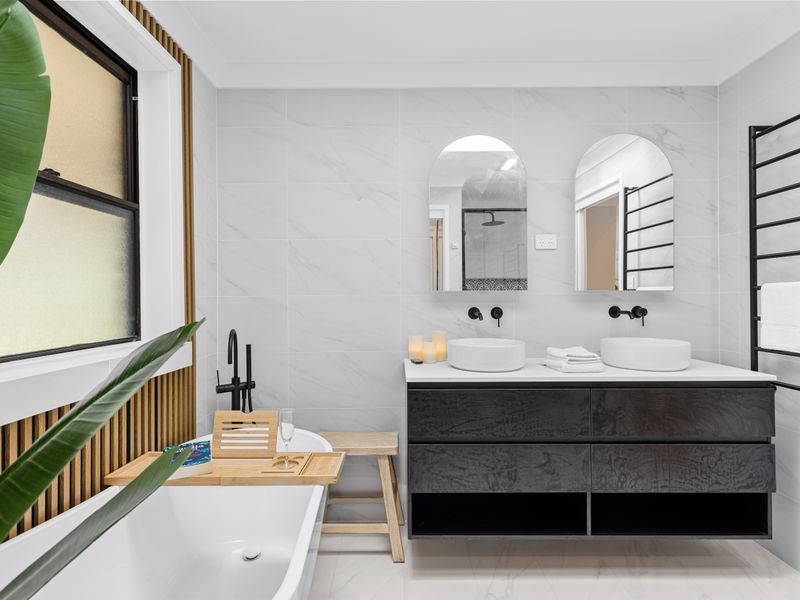 Stylish double vanity bathroom with modern fixtures