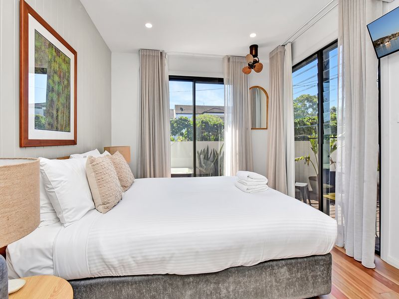 Cozy bedroom with natural light and soft tones