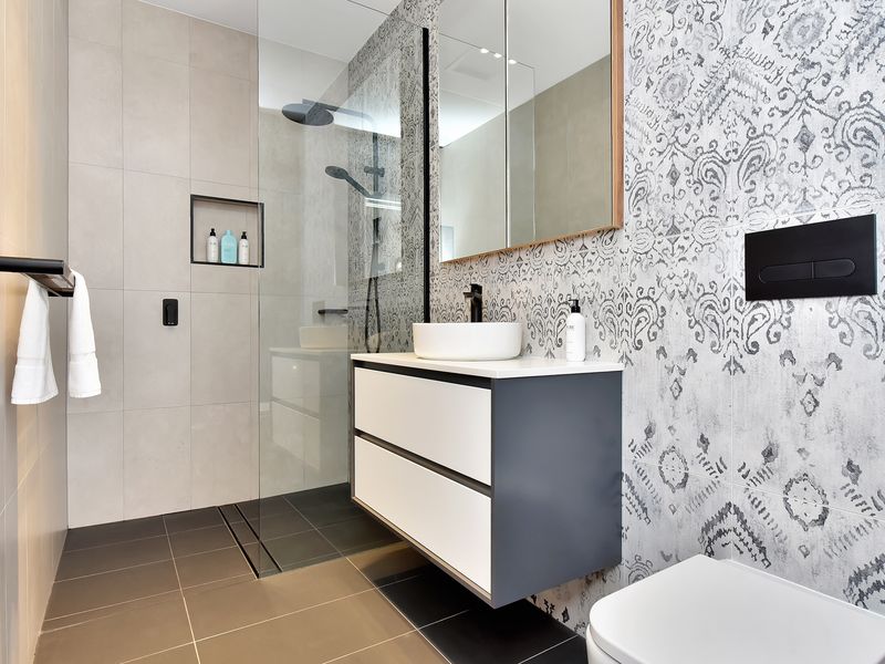Stylish bathroom with walk-in shower and modern design