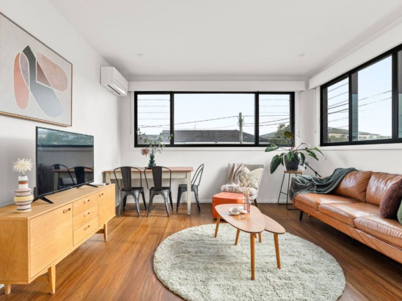 Modern living area with TV and natural light