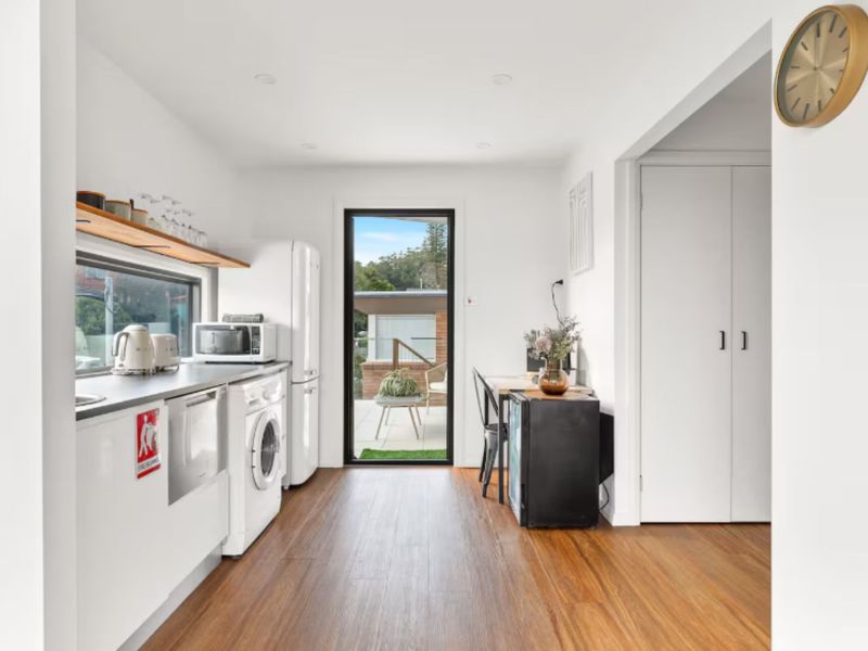 Contemporary kitchen with access to balcony