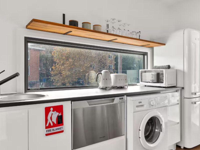 Kitchen sink area with large window view