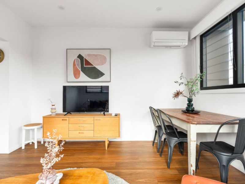 Dining area with air conditioning and TV setup